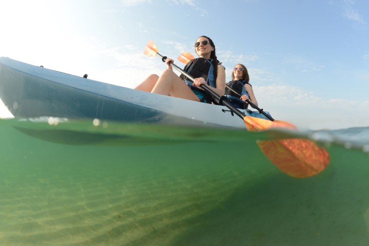 Girls doing kayak on noosa river